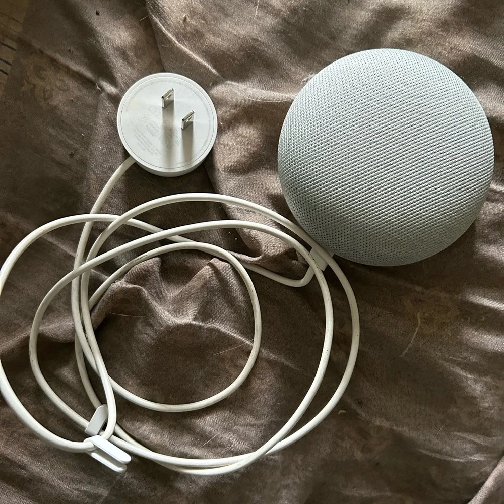 Google Mini Home nest color grey and orange. Comes with power cord.